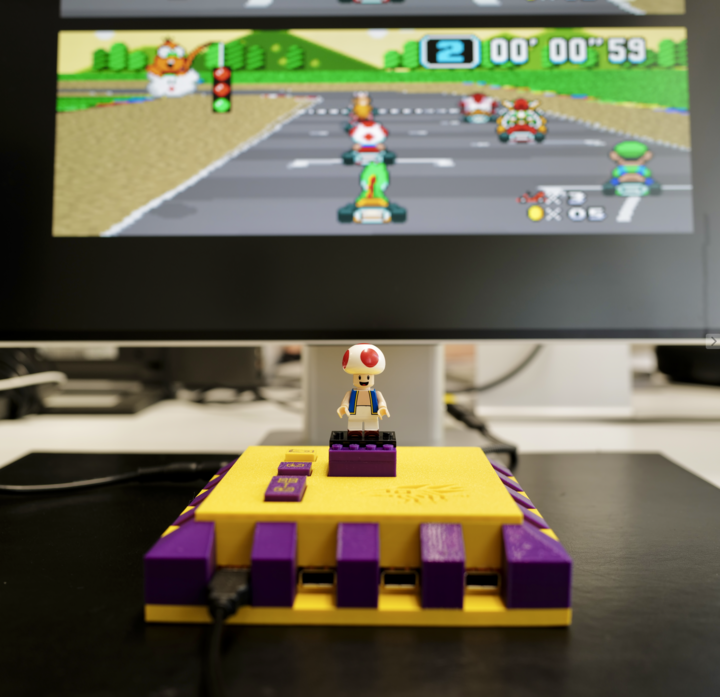 Rook MK1 console with LEGO Toad, running Super Mario Kart.